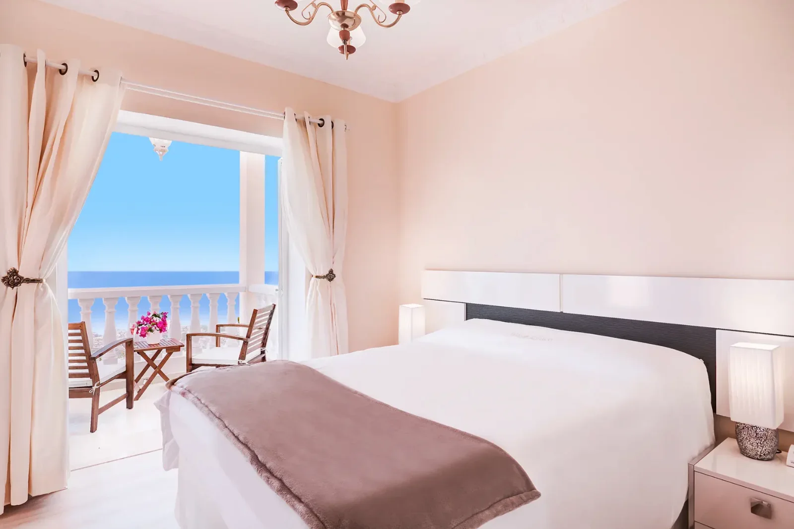 First-floor bedroom with a private Atlantic-view balcony at Villa Solea