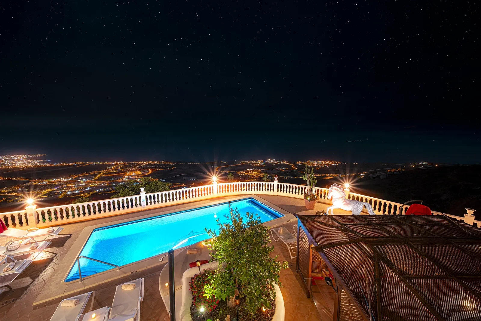 Villa Solea pool terrace and the Tenerife coast at night