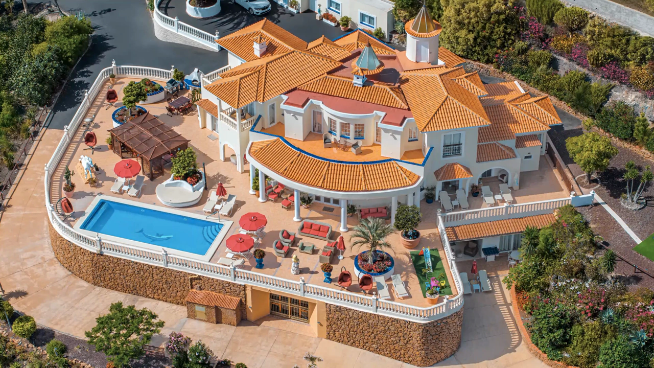 Aerial journey from Villa Solea in Adeje to its illuminated pool terrace